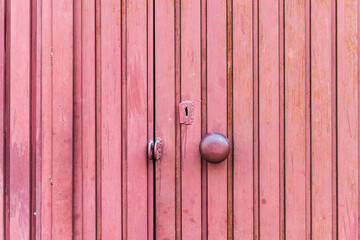 Khanyar, Srinagar, Jammu and Kashmir, India. A red painted wooden door.