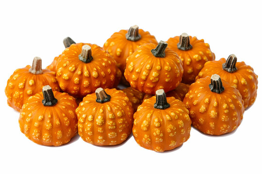 A Pile of Small, Bumpy Orange Pumpkins Isolated on a White Background