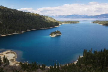 Emerald Bay at Lake Tahoe with mountains and clouds