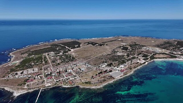 Robben Island Cape Town South Africa. 24.12.2024. Video. Aerial view of Robben Island  the housing, The former prison and harbour.