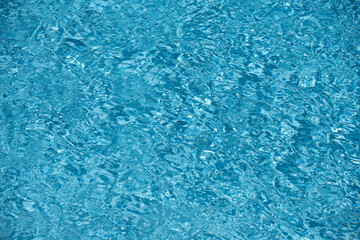 Pool water surface with copy space. Sea ocean background. Water surface in swimming pool. Blue water background. Clear sea water texture.