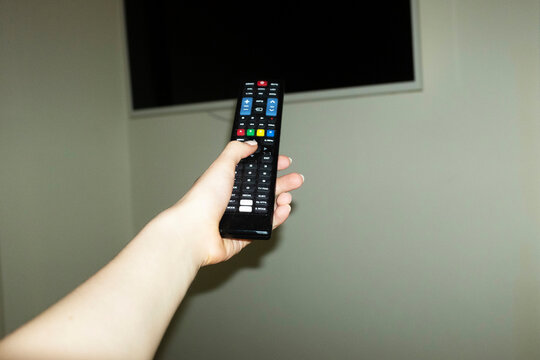 Pov/point of view of person switching on and watching tv television 
