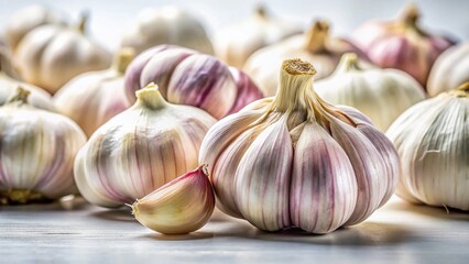 Obraz premium Fresh Garlic Cloves Isolated on White Background - Culinary Ingredient Stock Photo