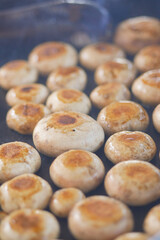A Closeup View of Grilled Mushrooms Sizzling on a Hot Cooking Pan