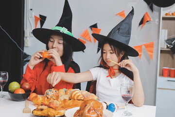 friendship, holiday and people concept - group of happy smiling friends in halloween costumes of...