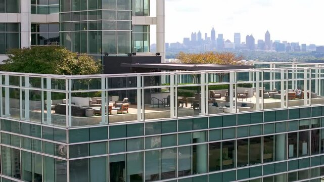 Rooftop restaurant, outdoor lounging on highrise building with Downtown Atlanta buildings in background, Georgia, Aerial view