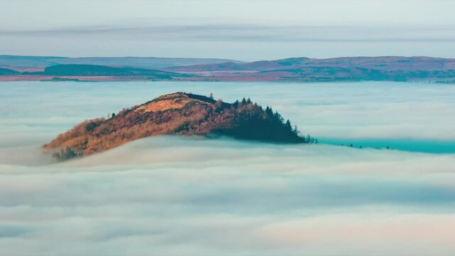 Animated timelapse of fog flowing along a rural valley