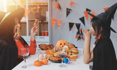 friendship, holiday and people concept - group of happy smiling friends in halloween costumes of...