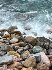 Colorful stones by the sea, Monterosso, Cinque Terre, Italy