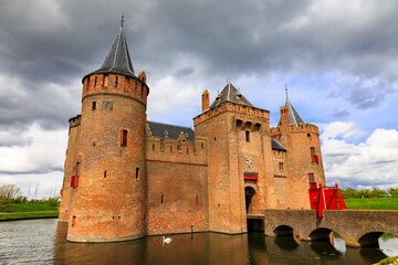 Obraz premium Netherlands, Muiden. Muiderslot Castle located on Vecht River. Fortress for water defense.