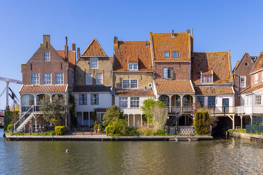 Netherlands, North Holland, Enkhuizen. Traditional Dutch row houses on a canal in Enkhuizen.