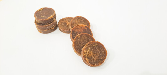 The palm sugar or Jaggery on white background	
