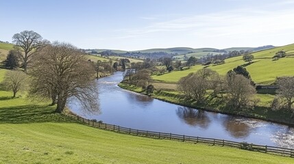 Obraz premium Serene River Valley Landscape Under Sunny Skies