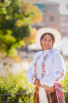 Hispanic woman wearing traditional cayambe clothes during national festivities. Dia de la hispanidad