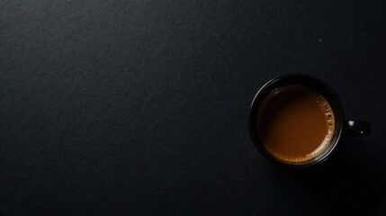 Aromatic Dark Roast Coffee in a Small Black Cup on Dark Surface