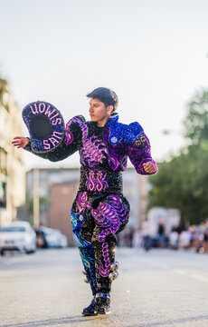 Hispanic man dancing Caporales with san simon costume during hispanicity day parade.