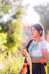 Young girl wearing traditional andean clothes participating in parade celebrating hispanic heritage