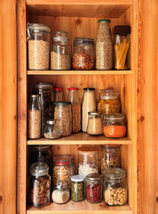kitchen pantry food storage with recycled reusable glass jars on shelf