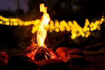 Burning firewood in the dark.