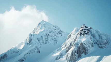 Obraz premium Snow Covered Mountain Peaks Under a Clear Sky