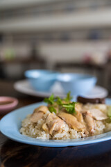 Steamed fragrant white rice topped with slice chicken. Chicken Rice is a traditional Asian dish