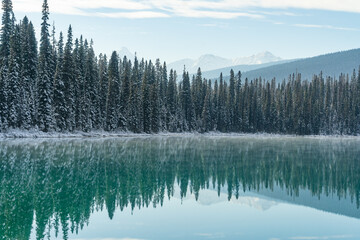 Emerald Lake in Yoho National Park, British Colombia, on a bluebird day under a dusting of snow