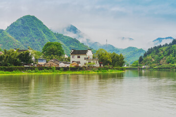 Fototapeta premium Tourism Scenery of Ancient Towns, Ancient Buildings, and Rivers in the Mountainous Areas of Anhui Province, China On April 22, 2024