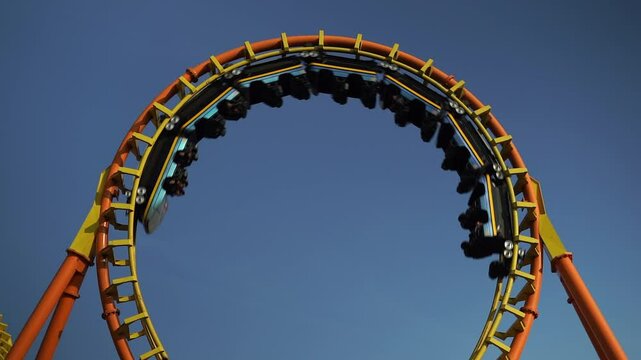 Roller coaster Ride against Roller coaster in the amusement park.