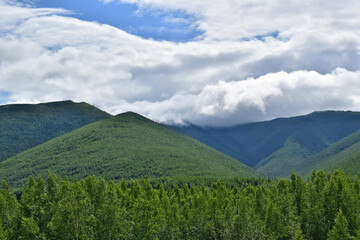 Green mountains and a sky with clouds
