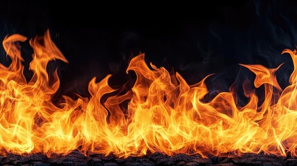 Fototapeta premium Fire abstract background concept. Bright, flickering flames against a dark background, representing heat and energy.