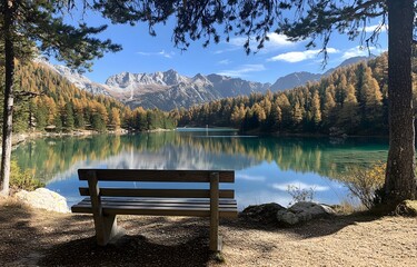 Serene mountain lake view with autumn colors and a wooden bench