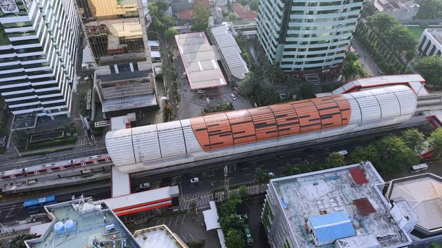 Light rail line and car traffic in SCBD district of Jakarta, Indonesia aerial drone video of transportation in the Indonesian capital city 