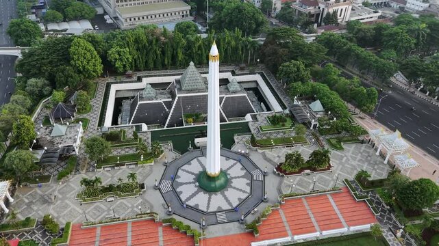  Monumen Tugu Pahlawan (Heroes Monument) in Surabaya, East Java, Indonesia drone video &mdash; Aerial view of tall white pillar and museum to commemorate battle of November 10, 1945