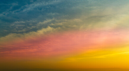 Enjoy a panoramic view of the skyline. The sun rises in the morning sky with colorful clouds. and beautiful cloud patterns In the soft light of the morning	