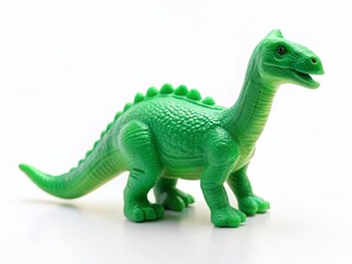 Obraz premium Minimalist Dinosaur Toy Photography: Isolated Green Plastic Dino on White Background