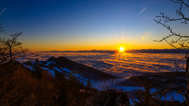 Beautiful last sunrise of 2024. Alps in the background and central Switzerland covered in clouds. Seen from Belchenflue peak in Switzerland (31.12.2024)