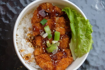 chicken katsu rice bowl. Chicken Katsu also known as panko chicken or tori katsu is a Japanese dish, consisting of fried chicken made with panko bread crumbs. Japanese food.