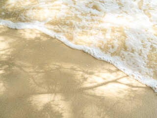 Shadow leaf on wave sea blue summer background with sand beach at coast island scene mockup water nature travel vacation holidays tropical, mockup ocean ecosystem energy change environment.