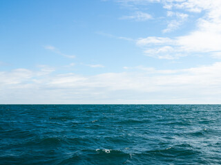 Obraz premium Summer background sea blue with cloud sky, coast island scene mockup water nature travel vacation holidays tropical, mockup ocean ecosystem energy change environment, backdrop product cosmetic