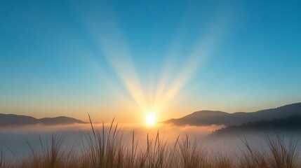 Fototapeta premium Serene Sunrise Over Mountains with Radiant Rays and Misty Landscape