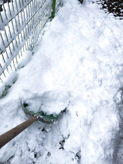 clearing snow with a snow shovel © jgdanwoo