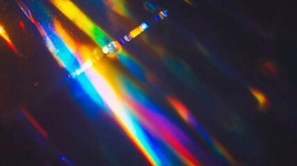Prismatic light leaks with rainbow bokeh on dark background