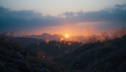 Obraz premium Serene Sunset Over Silhouetted Mountains and Rocks