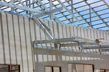 Obraz premium steel roof beam new house under constructed