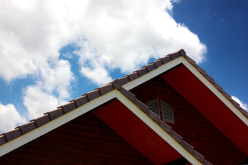 roof design triangle shape overlap of building against blue sky