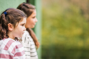 Fototapeta premium Sisters learning about animal care at a sanctuary in asturias, spain