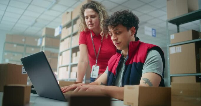 Team of warehouse associates or inventory managers talk, prepare parcels for shipping to customers, check information on laptop computer, work in post office. Logistics center or delivery service.