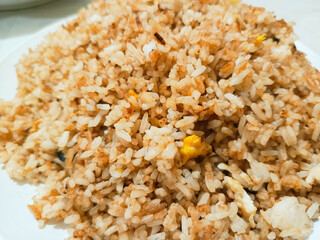 photo of mother's homemade village fried rice for breakfast placed on a white plate