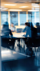Blurred silhouettes collaborating in a high-tech logistics office.