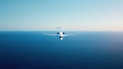 Naklejka premium Sleek and opulent white private jet soars gracefully over tranquil blue skies, embodying luxury in flight.